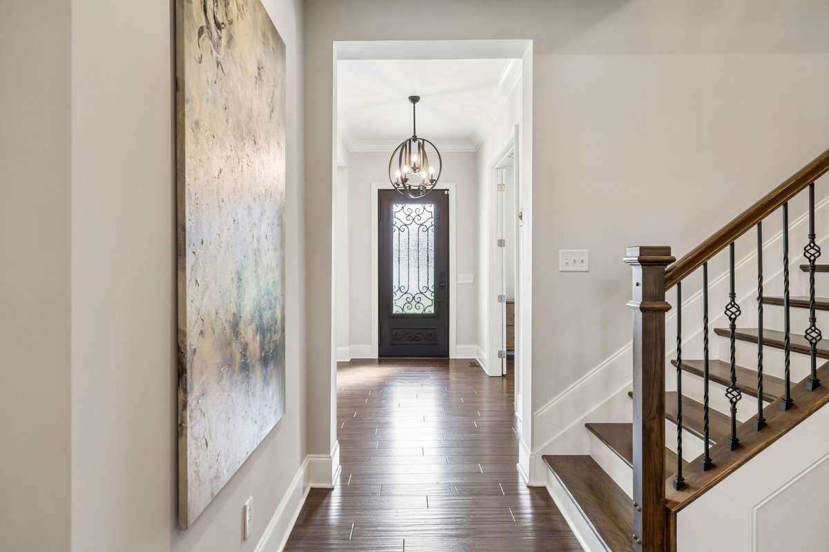 Gorgeous hardwood floors are throughout the main living areas, on the stairs and in the Primary Bedroom.