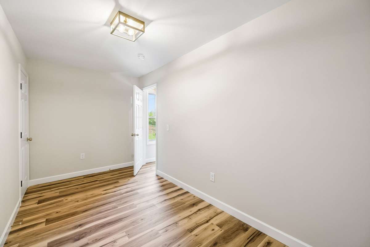 Office with full size door to attic- (lots of room for storage or expansion)