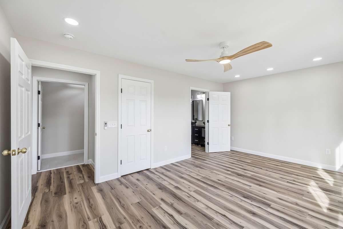 Primary bedroom with walk-in closet.