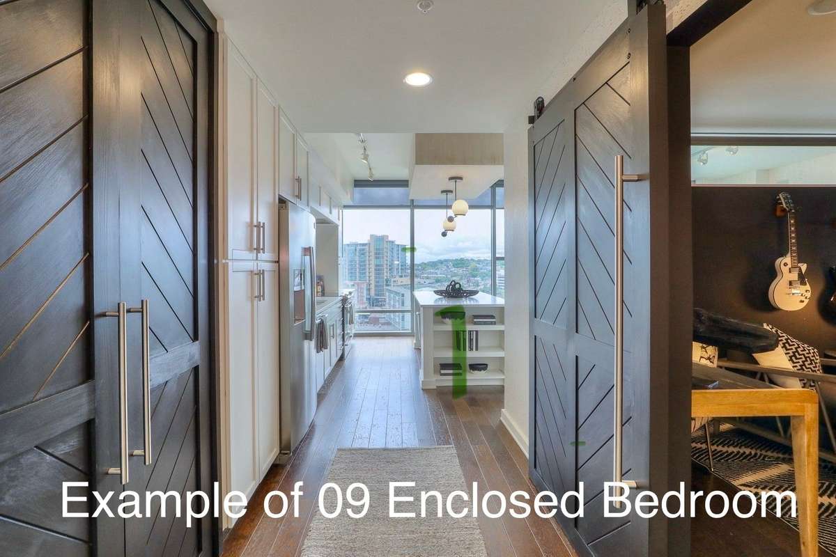 Entry way of lower 09 stack unit showing enclosed bedroom with sliding door as well as office nook enclosed for privacy.   Imagine the possibilities