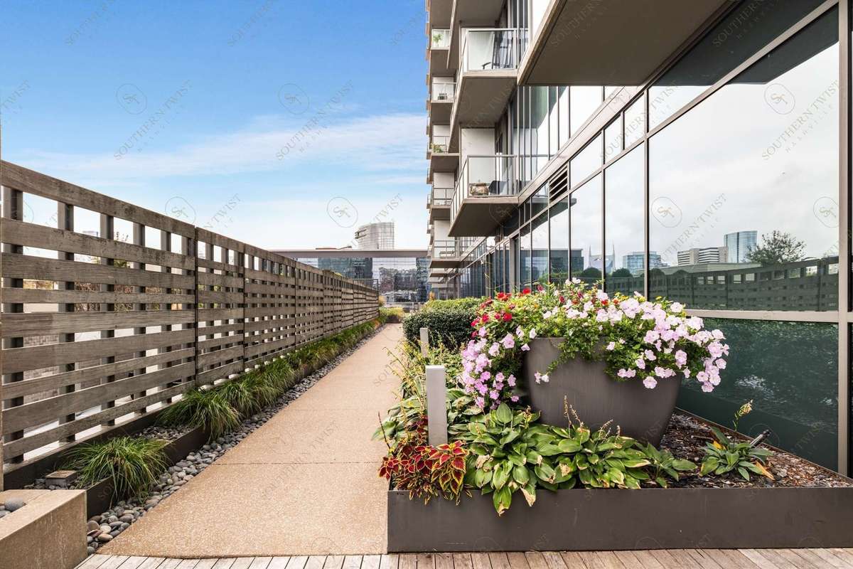 Walk way to the green roof uniquely separated from the bustling pool area tallowing for quiet retreat from summer pool fun