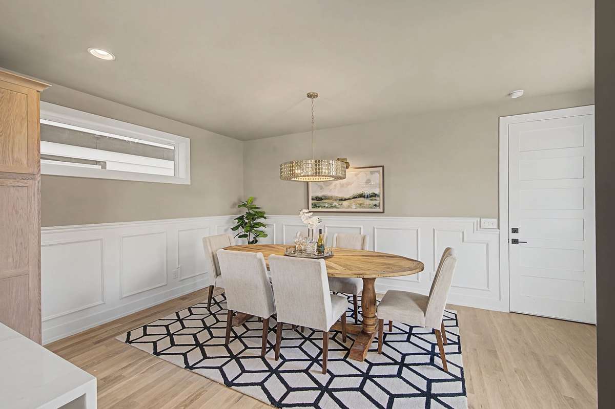 Separate formal Dining Room with wainscoting trim detail