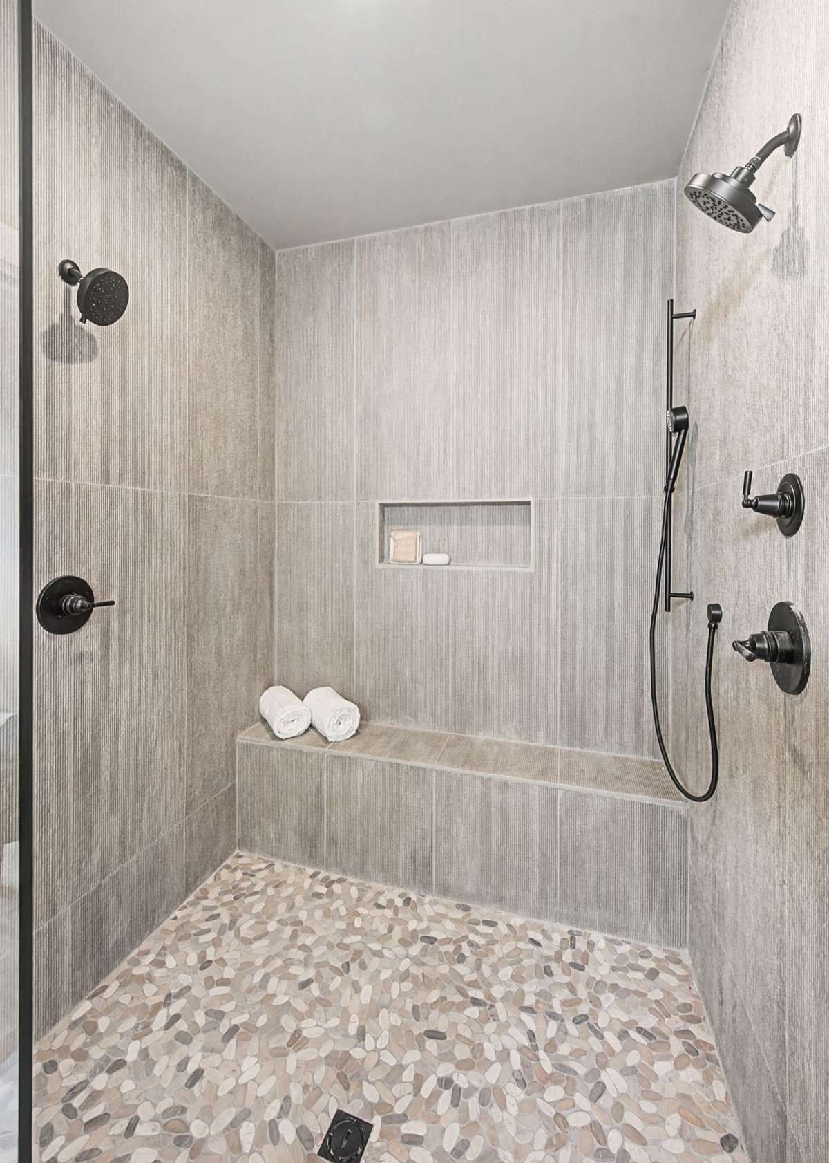 Luxurious oversized Primary Shower with two shower heads