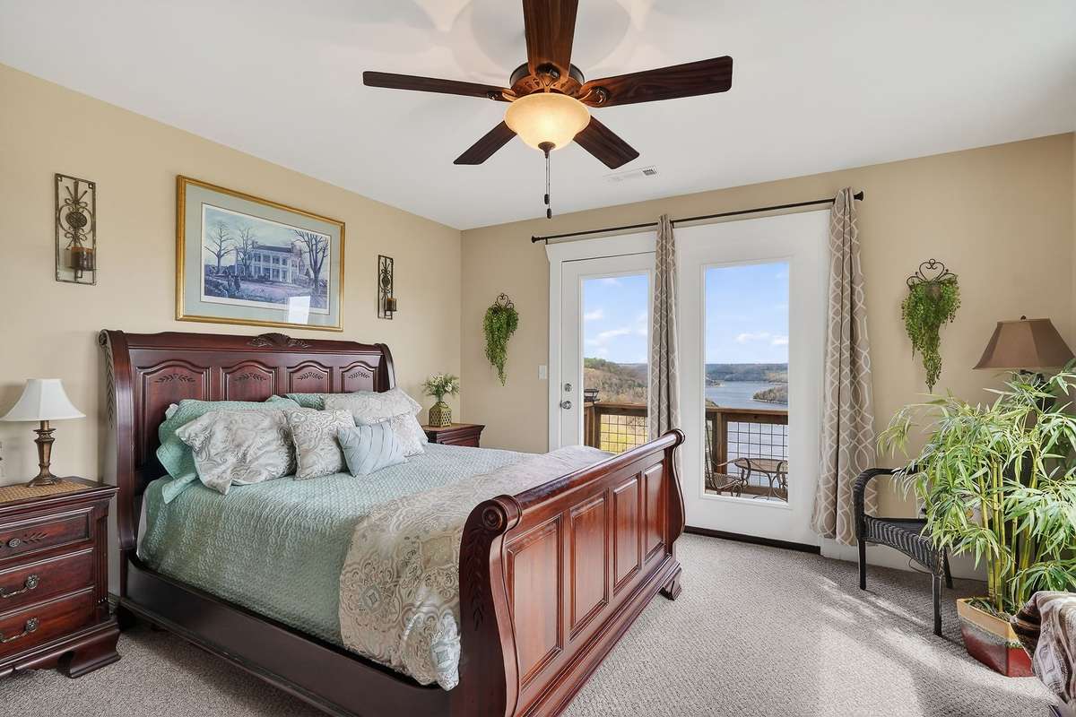 Upstairs leading out to deck with lake views