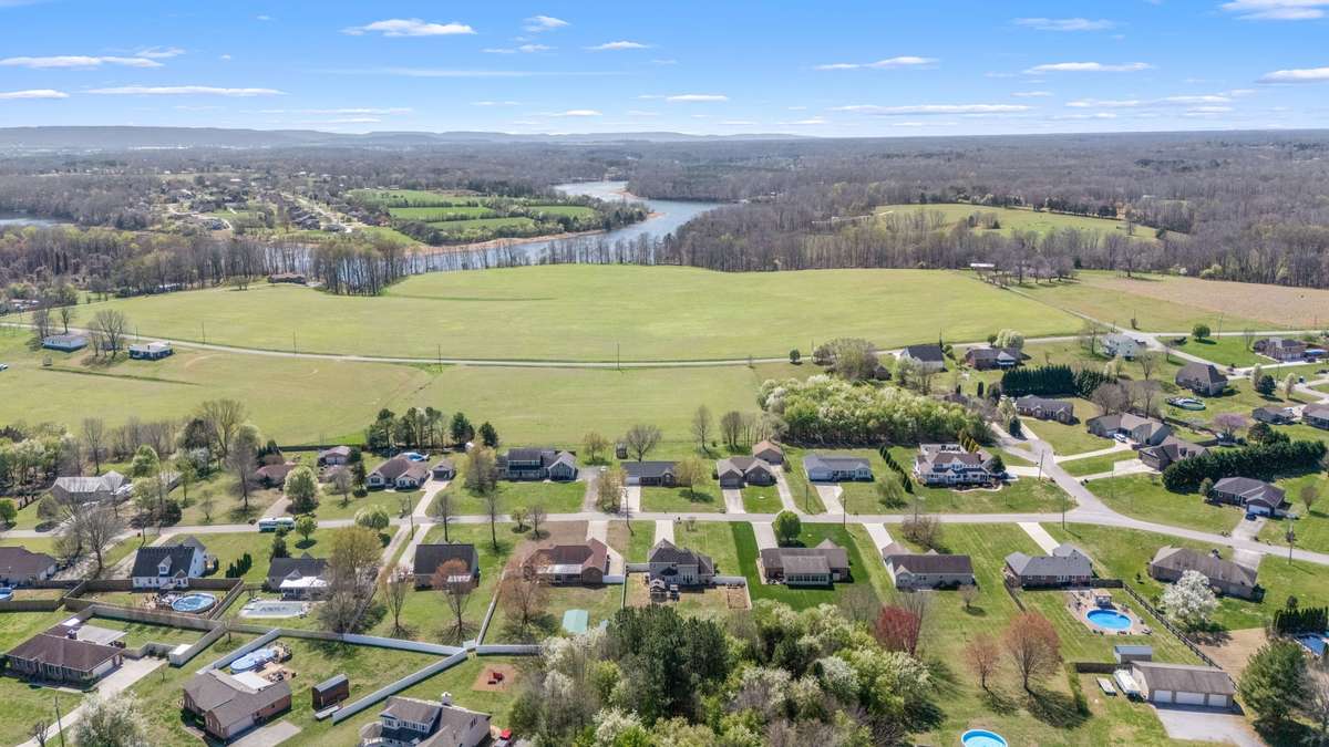 Aerial view of neighborhood.  The lake curves all around the subdivision