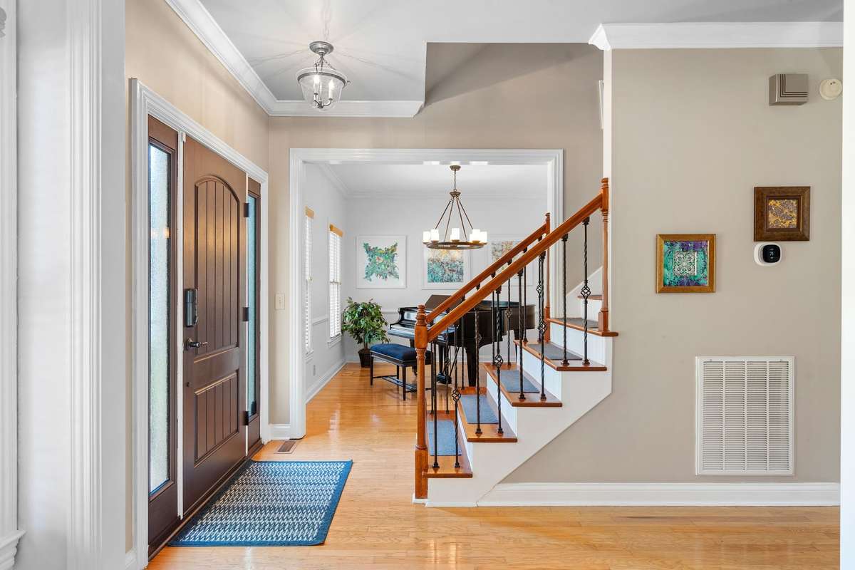 Front entry with 2 flex spaces to the right and the left.
