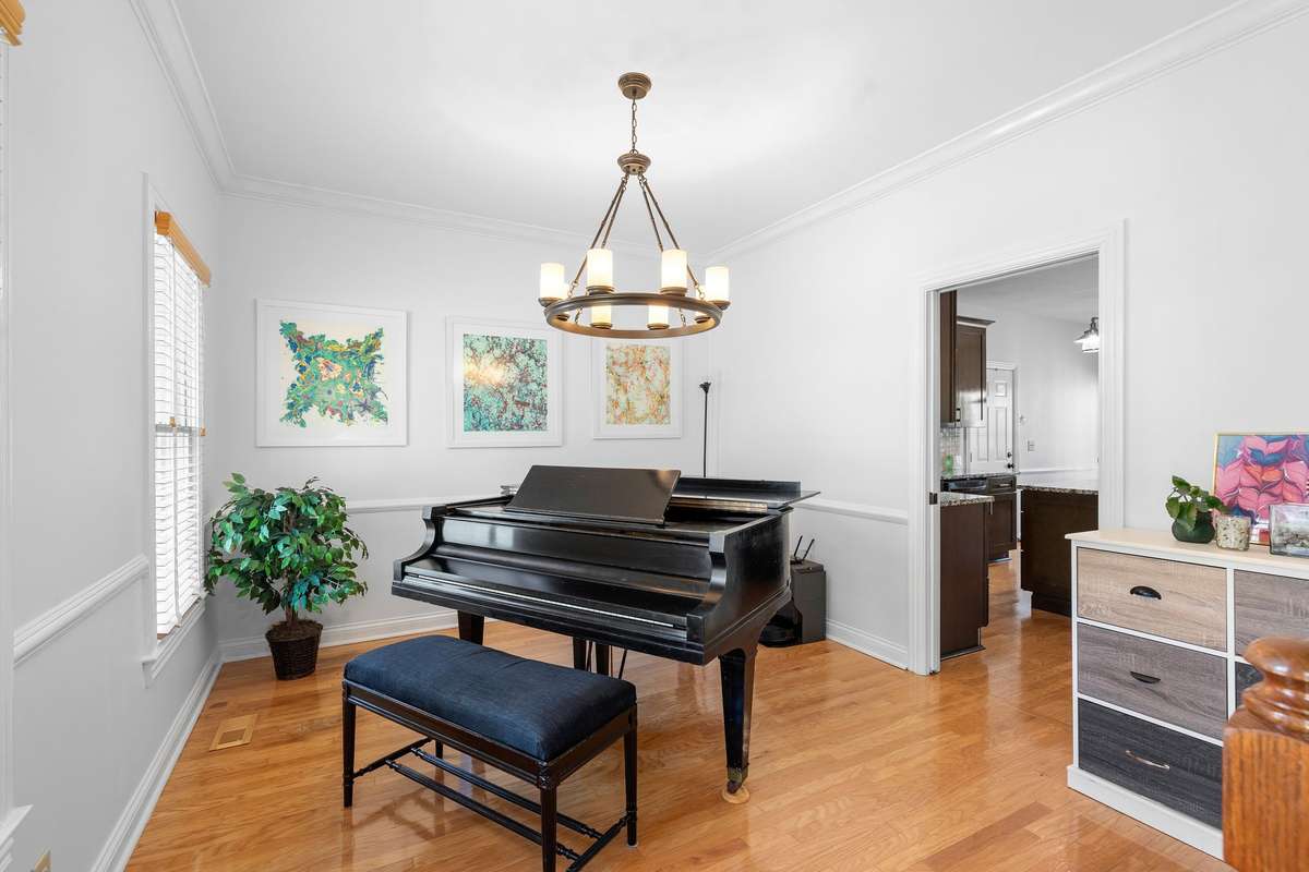To the left is what was originally built for a formal dining room, but currently being use to display the grand piano.