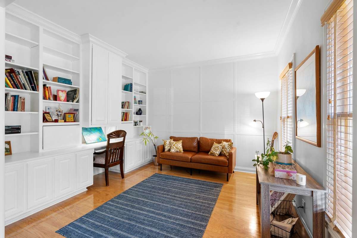 To the right of the front door is the 2nd flex space currently being used for a home office taken advantage of the built-in bookcases and desk.