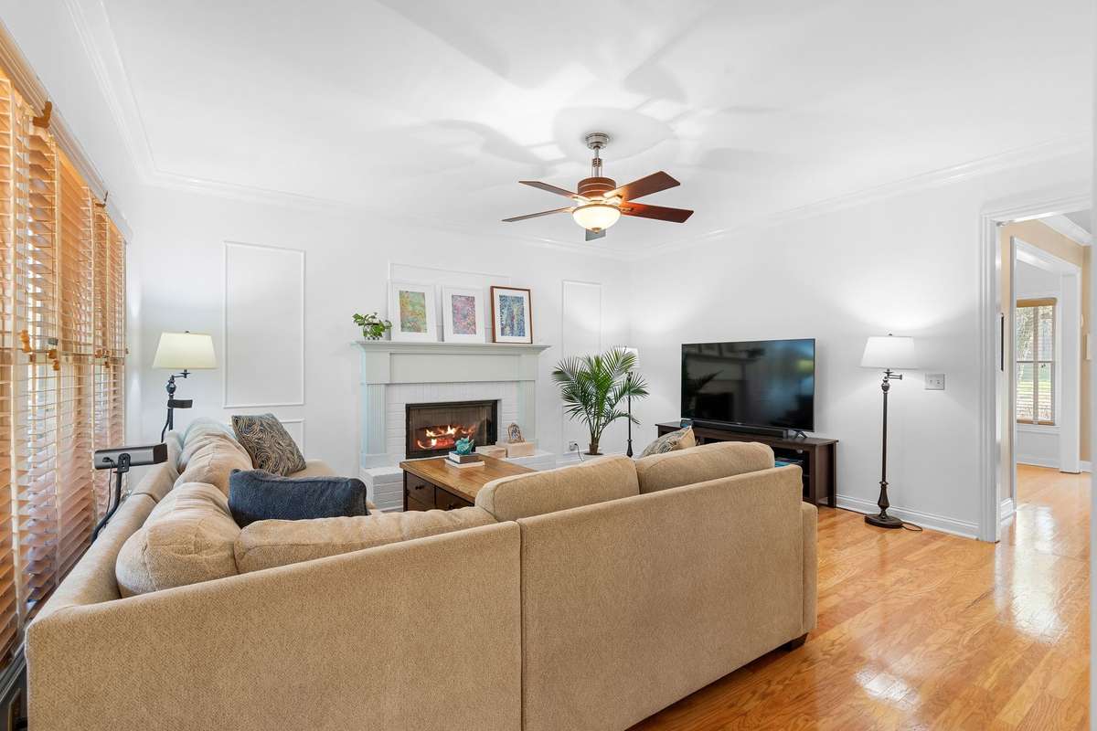 The living room is cozy and just the right size to fit a variety of furniture configurations.