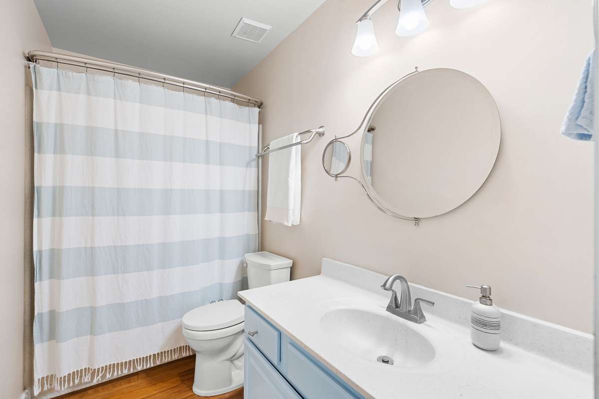 2nd Full Bathroom with a shower/tub combination and great lighting.