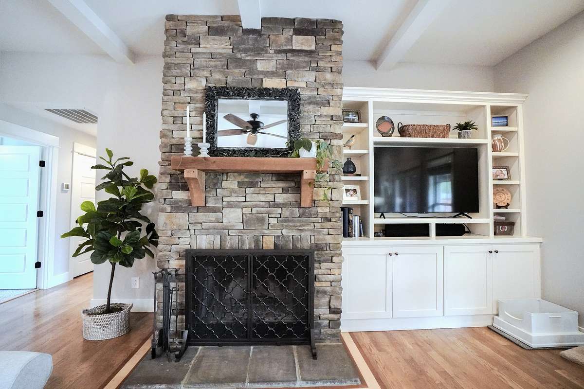 Stone Wood-Burning Fireplace and Built-in Cabinetry for the TV and storage