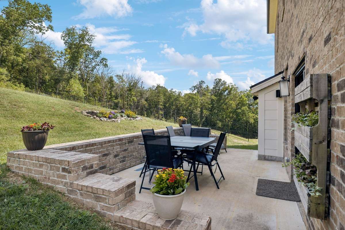 CURRENT PATIO AND BACKYARD LAYOUT  (See last photo for a conceptual AI design of how the backyard could be landscaped)