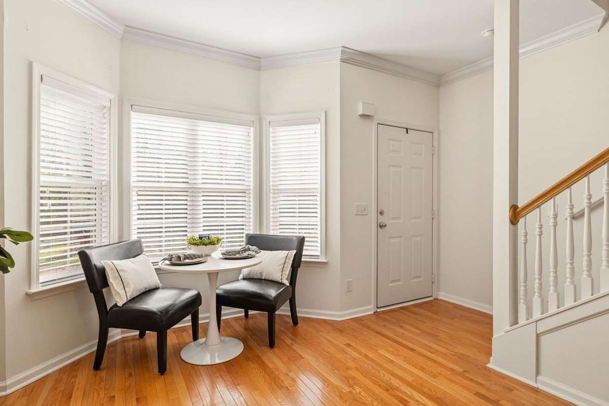 Space for a dining area in the front bay window.