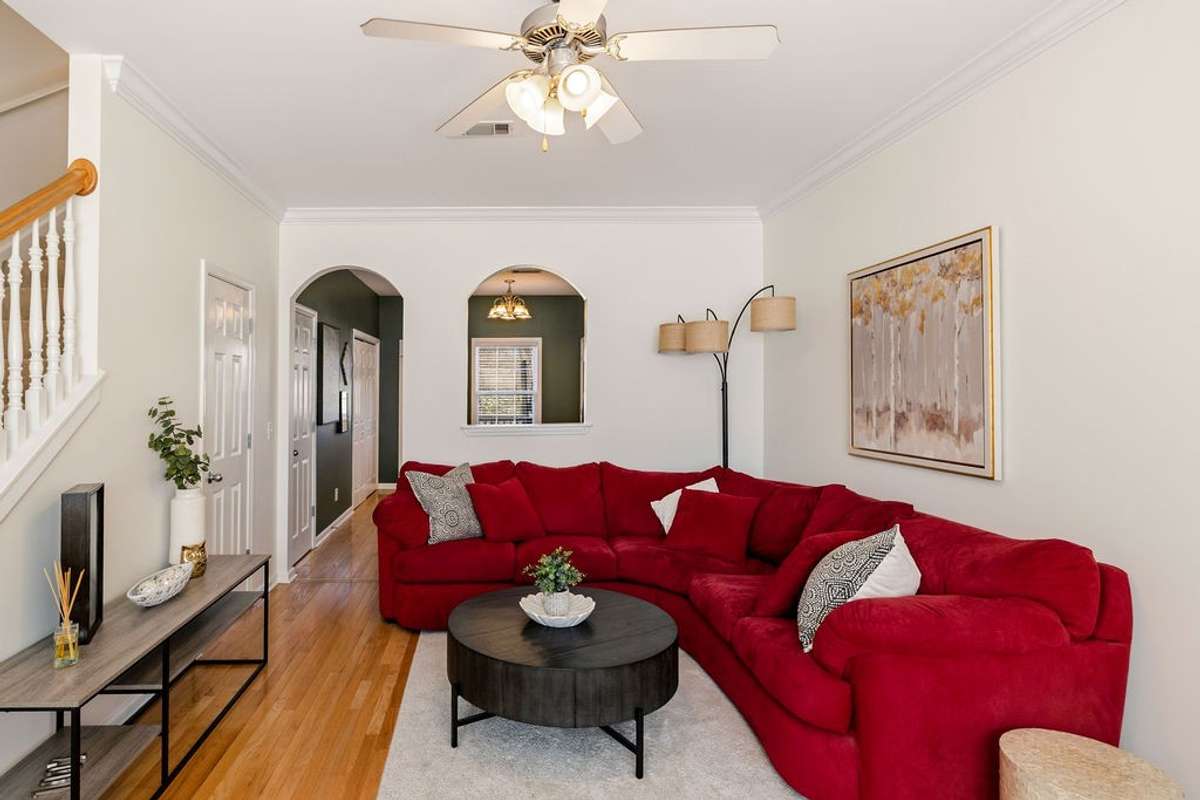 Living area is open to the kitchen complete with a half bath and laundry closet.