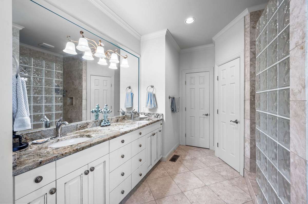 Granite custom built-ins jetted tub and walk-in tiled  shower
