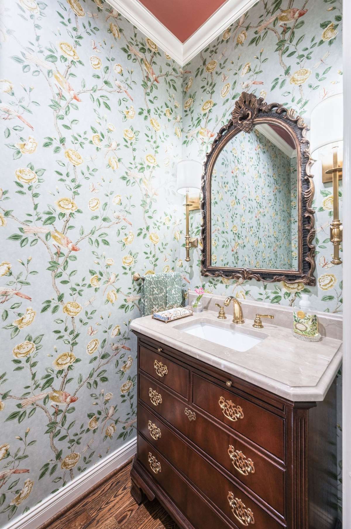 renovated power room with new wallpaper, custom vanity with marble top.