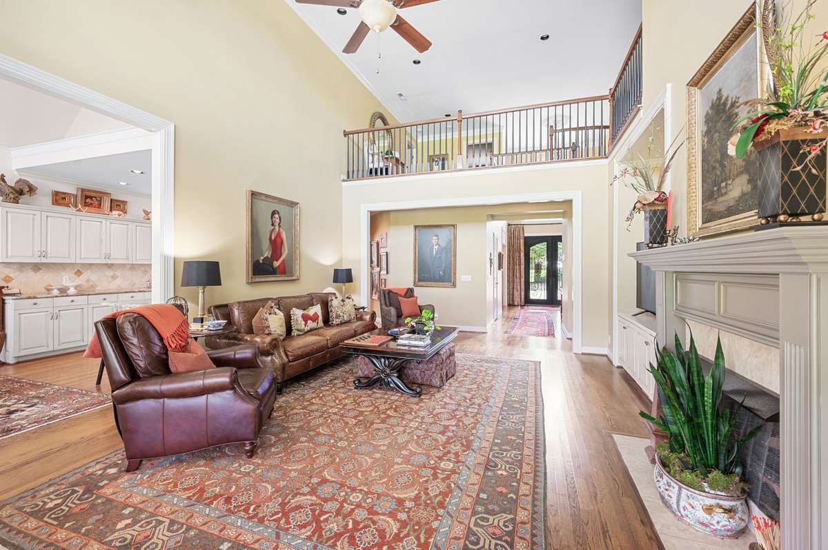 great room with vaulted ceilings , fireplace , custom built-ins.