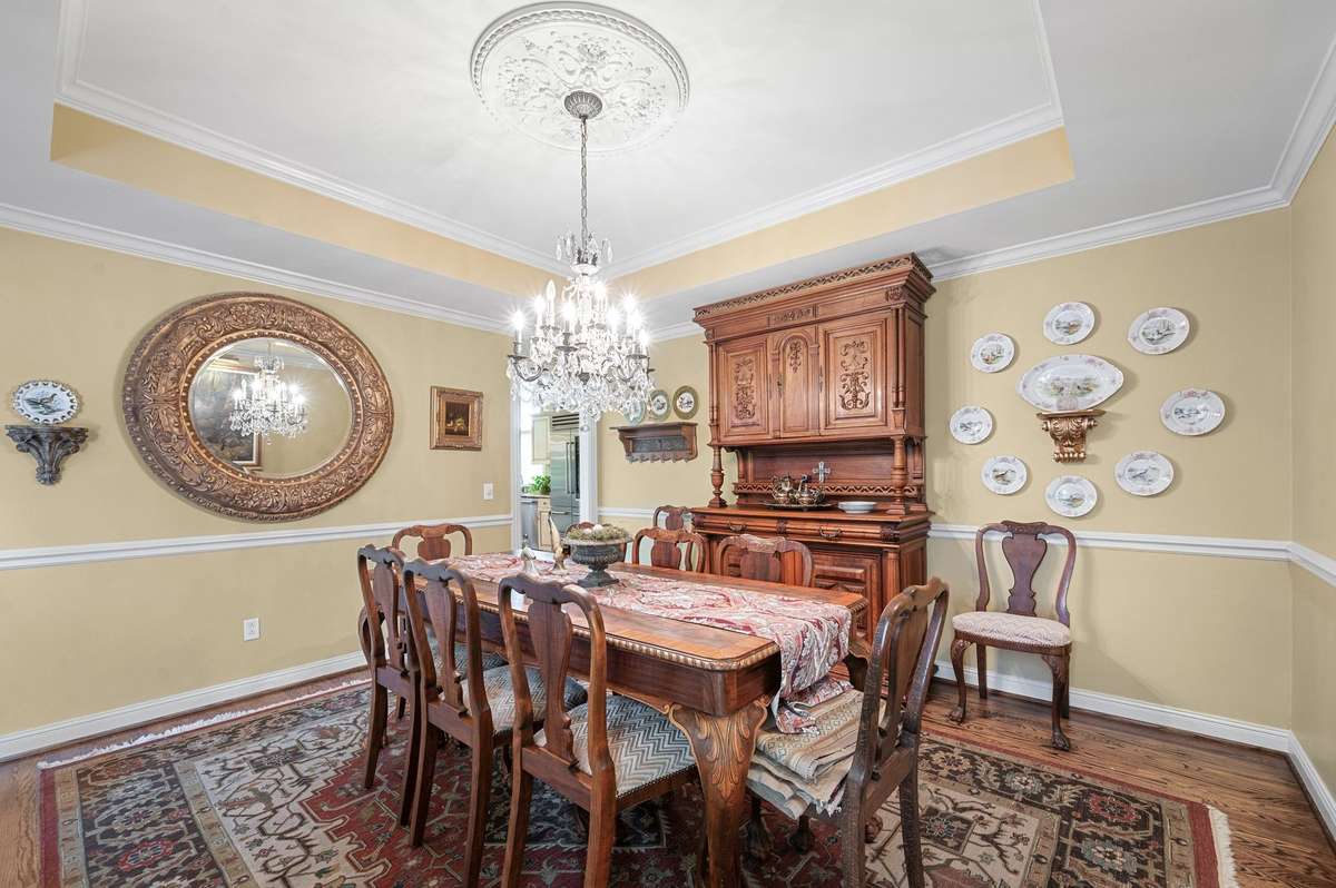 Tray Ceilings in Dining Room. plantation shutters.