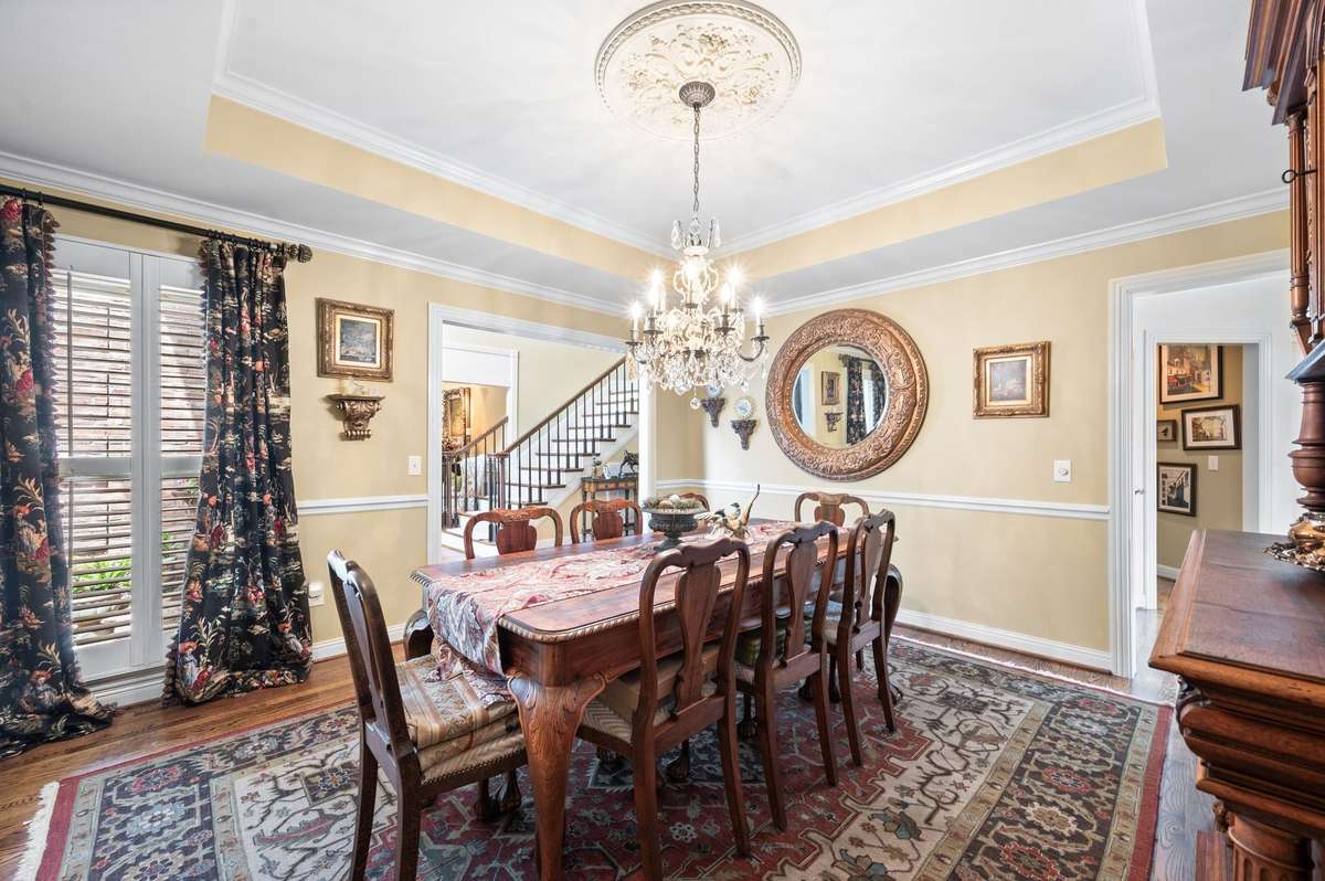plantation,  shutters,  hardwood flooring and tray ceiling.