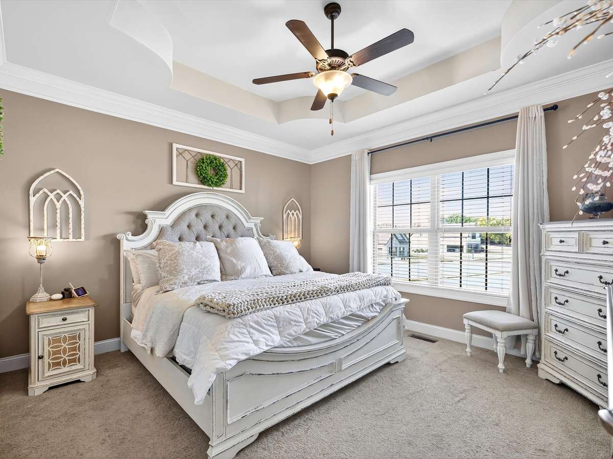 No this photo is not from a magazine... it is the luxurious master suite found on the main level.  Boasts trey ceiling, attached master bath, and walk-in closet with built-in shelving.