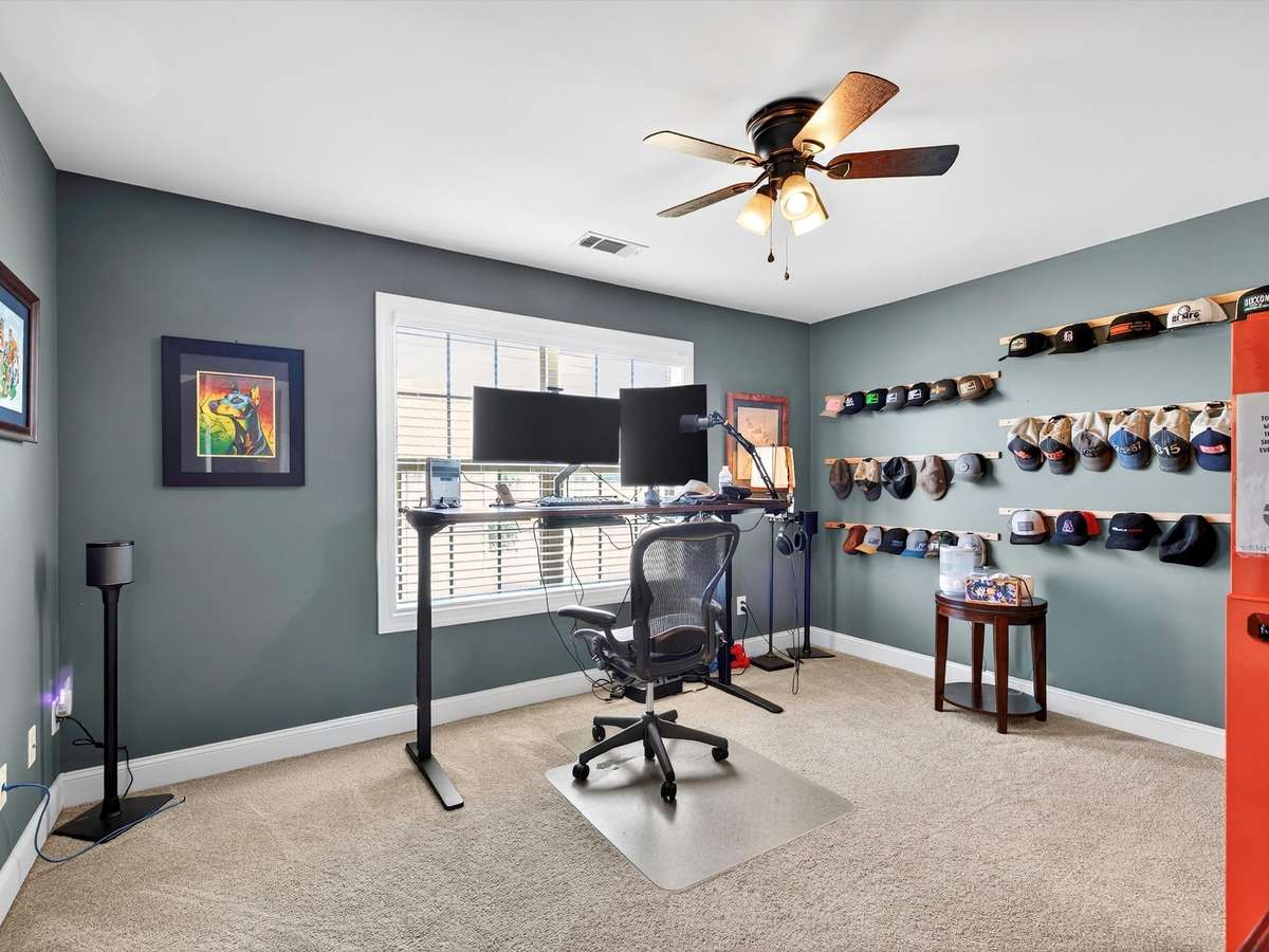 Bedroom 4 upstairs with multiple storage areas attached and oversized closet.