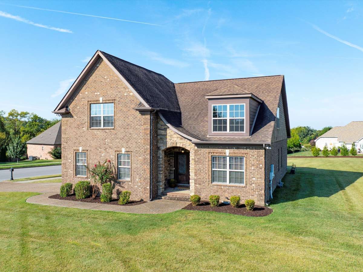 All brick exterior with stone accents at front entry! Easy to maintain landscaping.