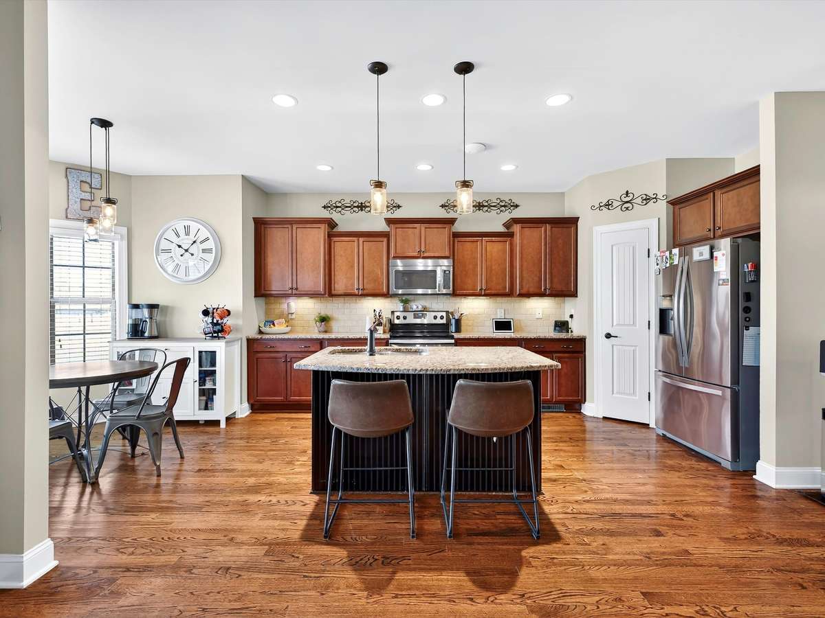 Large kitchen area with built-in pantry space and eating nook