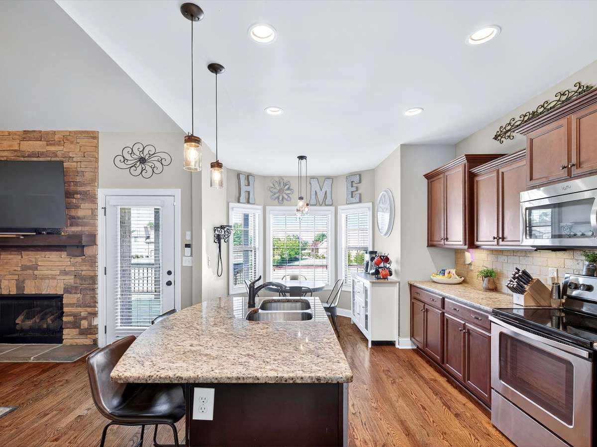 Natural wood flooring throughout living area