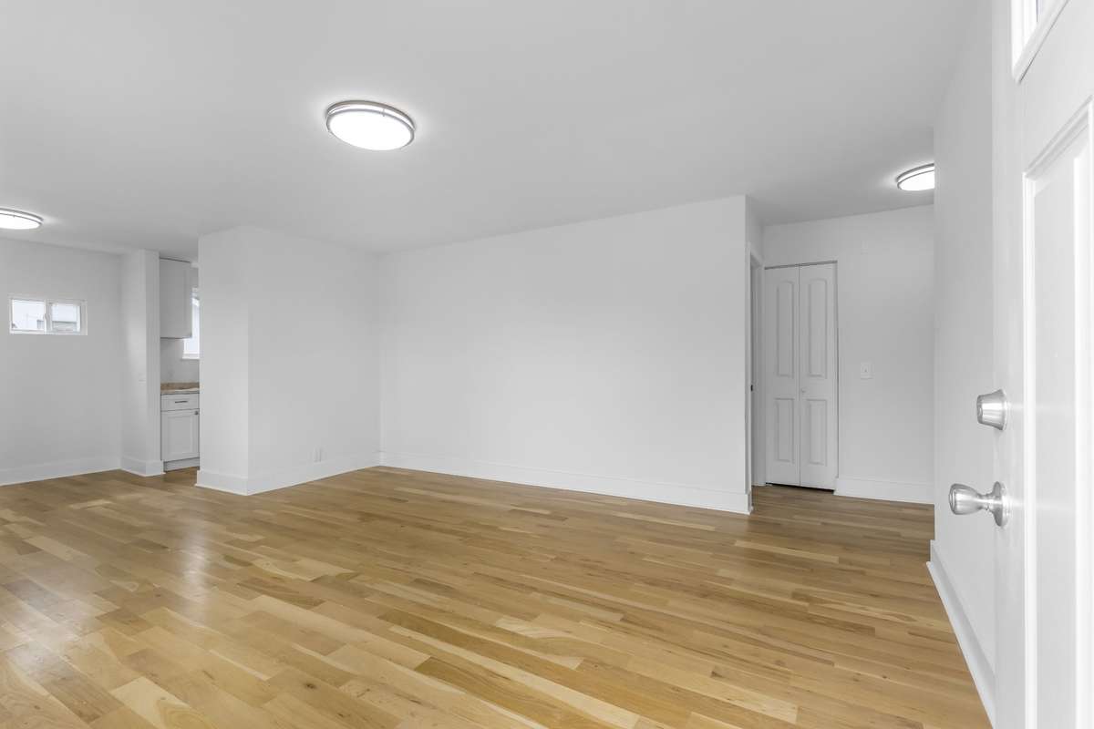 An alternate angle of the living area near the front entry.