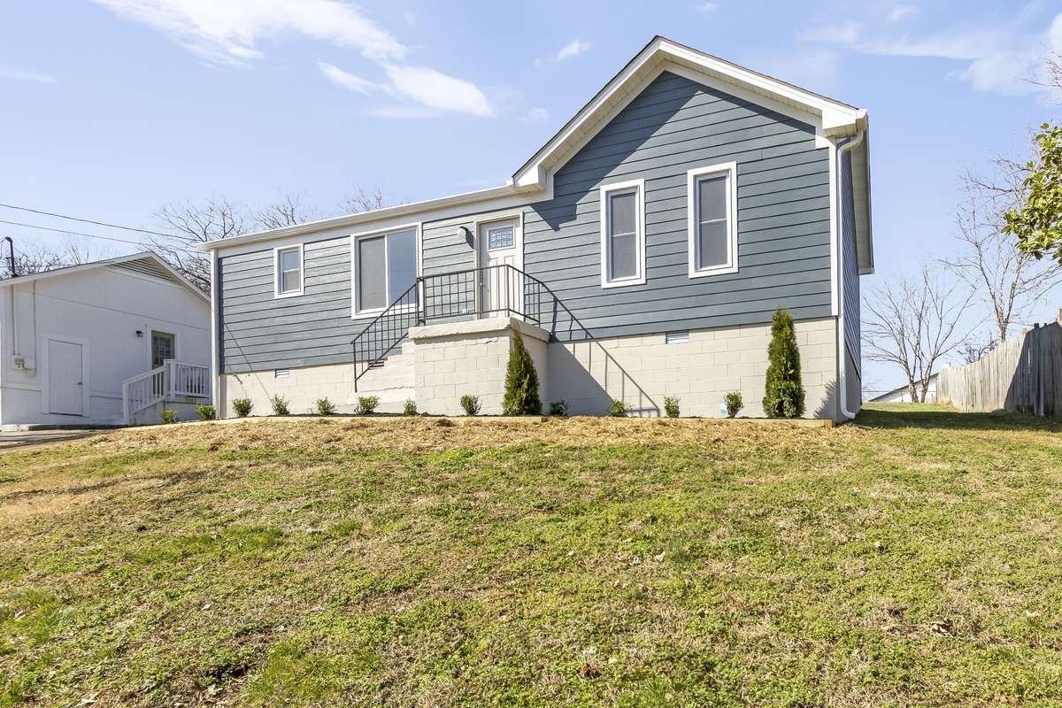 Another view of the home's updated exterior and fresh siding (new Feb 2026)
