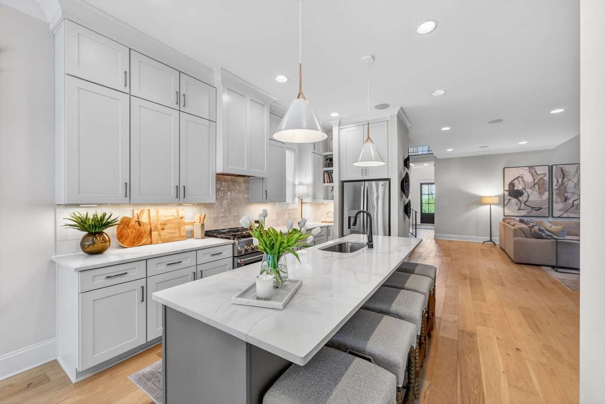A bright, chef-inspired kitchen with an expansive island and premium finishes.