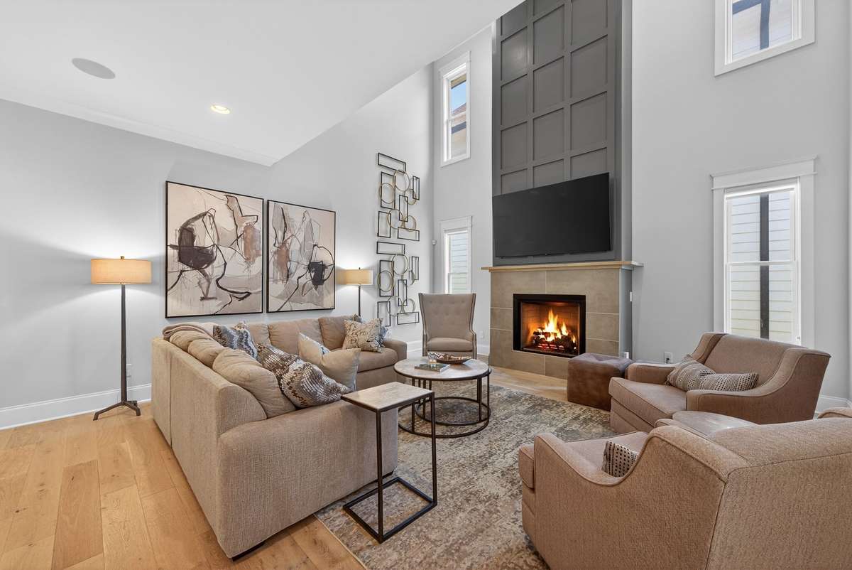 A stunning living space centered around a dramatic fireplace feature.