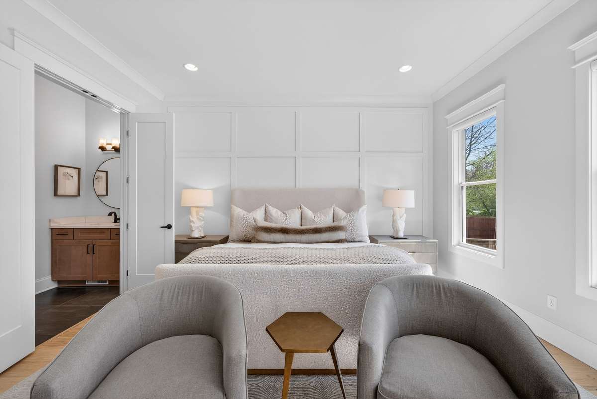 A beautifully designed primary suite offering comfort, light, and sophistication.