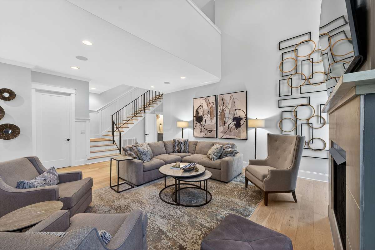A stunning living space centered around a dramatic fireplace feature.
