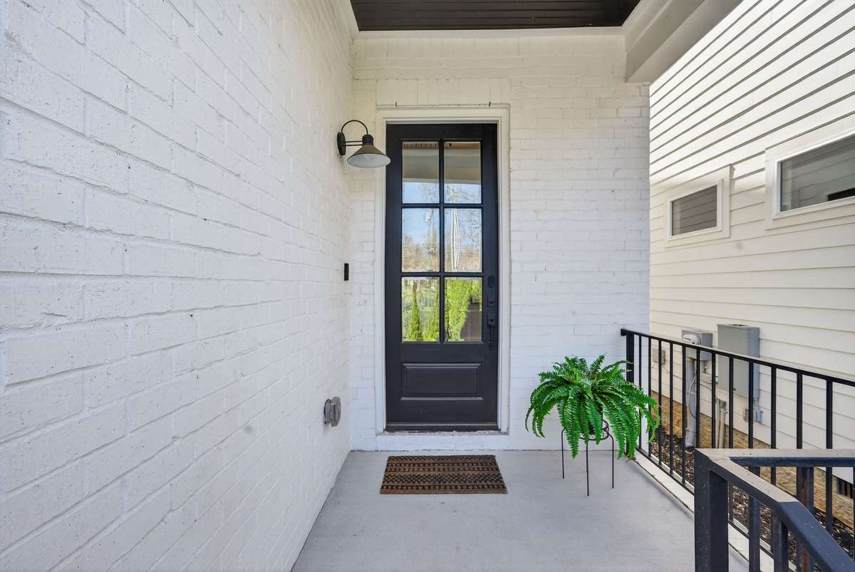 A welcoming covered entry with refined design.