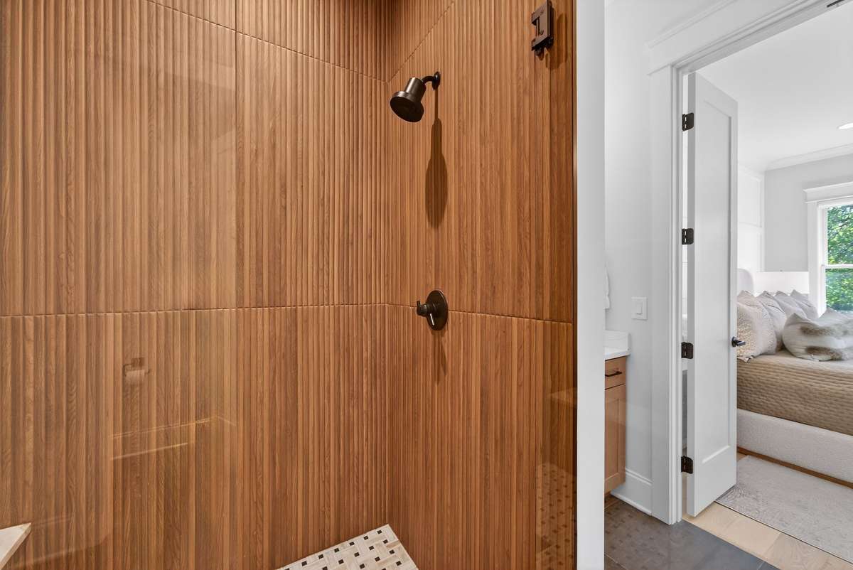 A spa-inspired bath with dual vanities and a walk-in shower.
