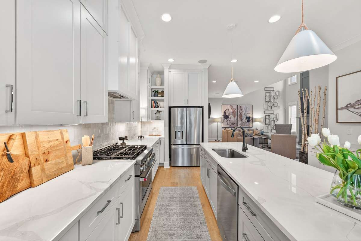 An expansive island anchors this open and functional kitchen.