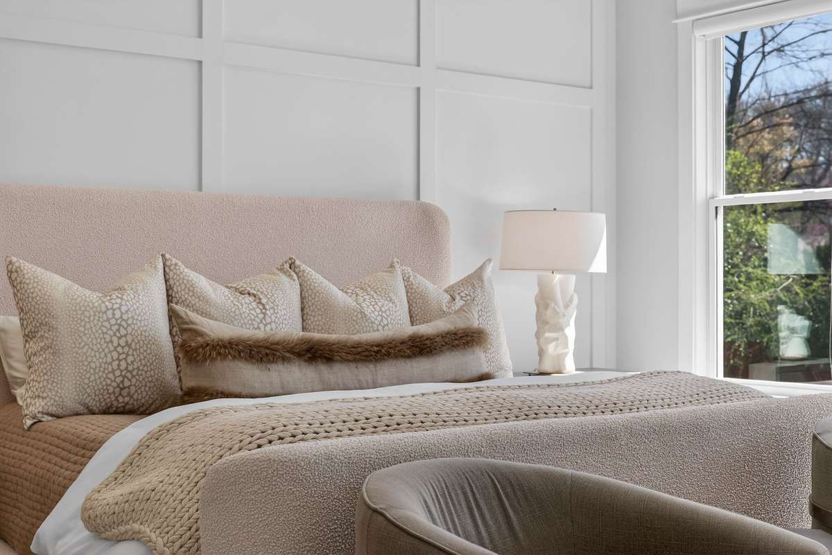 Thoughtfully curated details create a warm and inviting primary retreat.