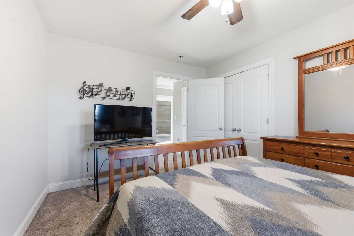 Ceiling fans provide comfort throughout, and a separate HVAC unit for the second floor ensures efficient climate control.