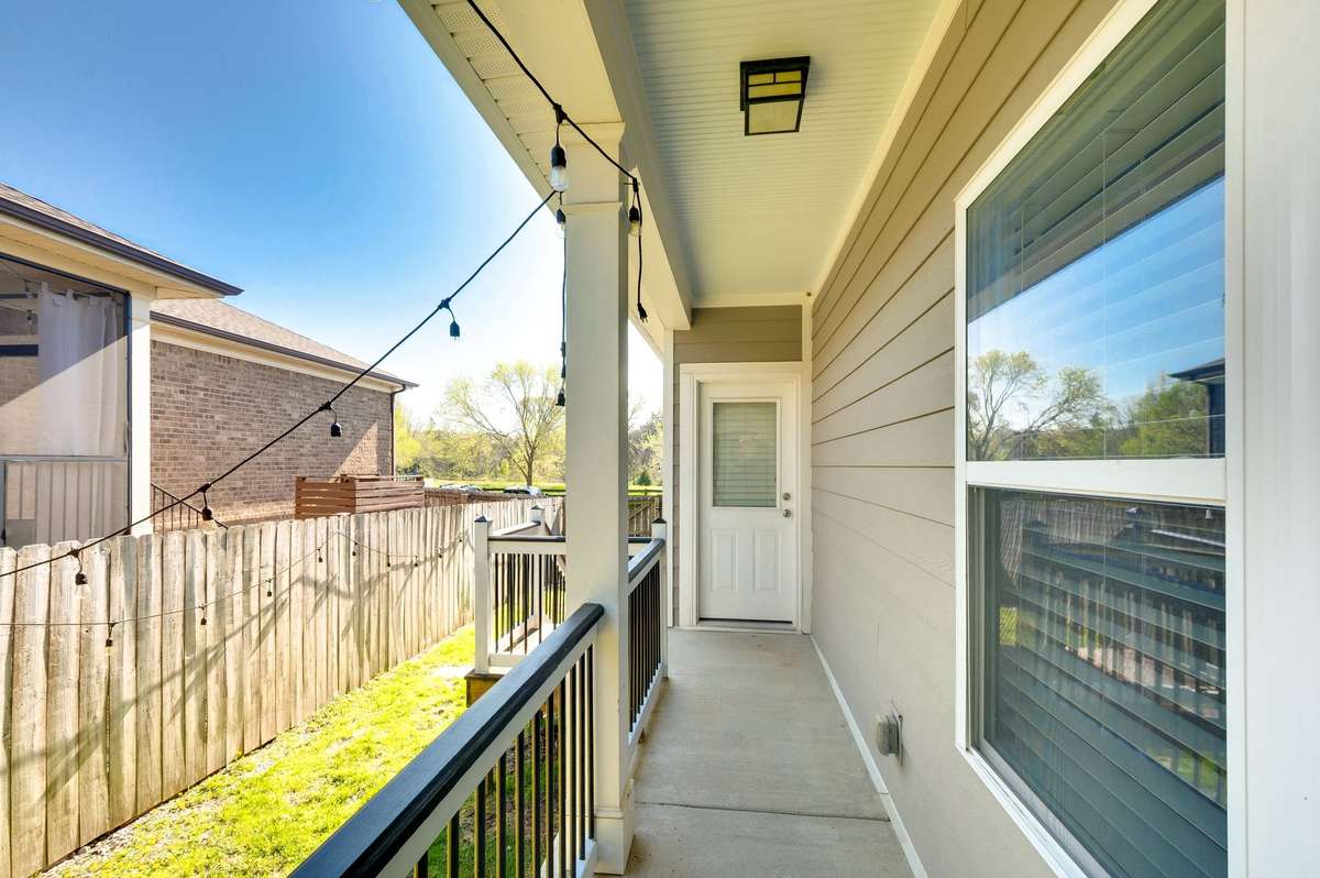 This covered walk way takes you to the garage from the kitchen area and also to the large side yard. The seller is offering $500.00 with an accepted offer to reseed the grass. They are unable to water if it is done now from their new location.