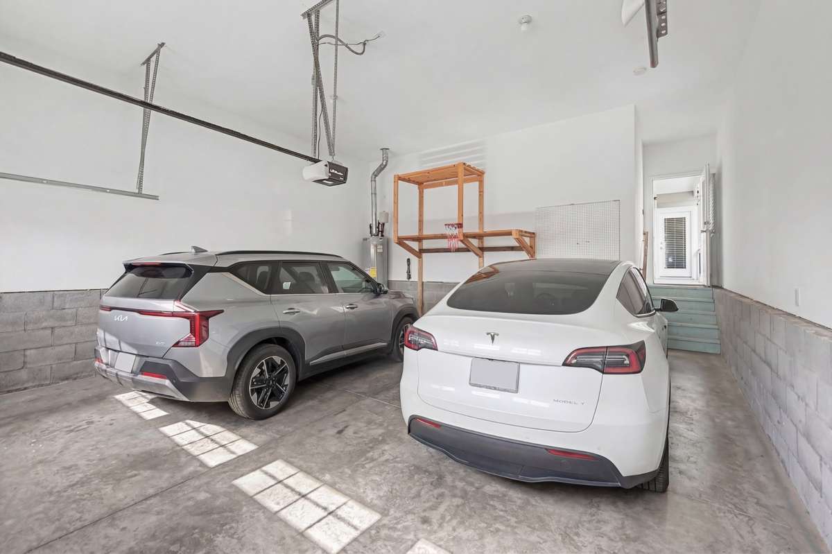 Large two car garage with very tall ceilings gives you plenty of room for storage as well as secure parking from the alley.