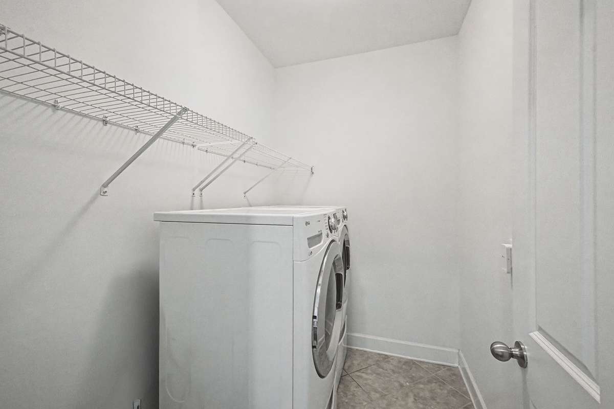 Huge laundry room primely positioned. Top of the line washer and dryer remain.