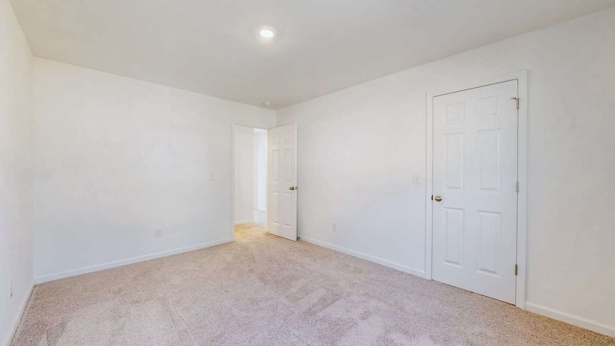 Bedroom with walk-in closet