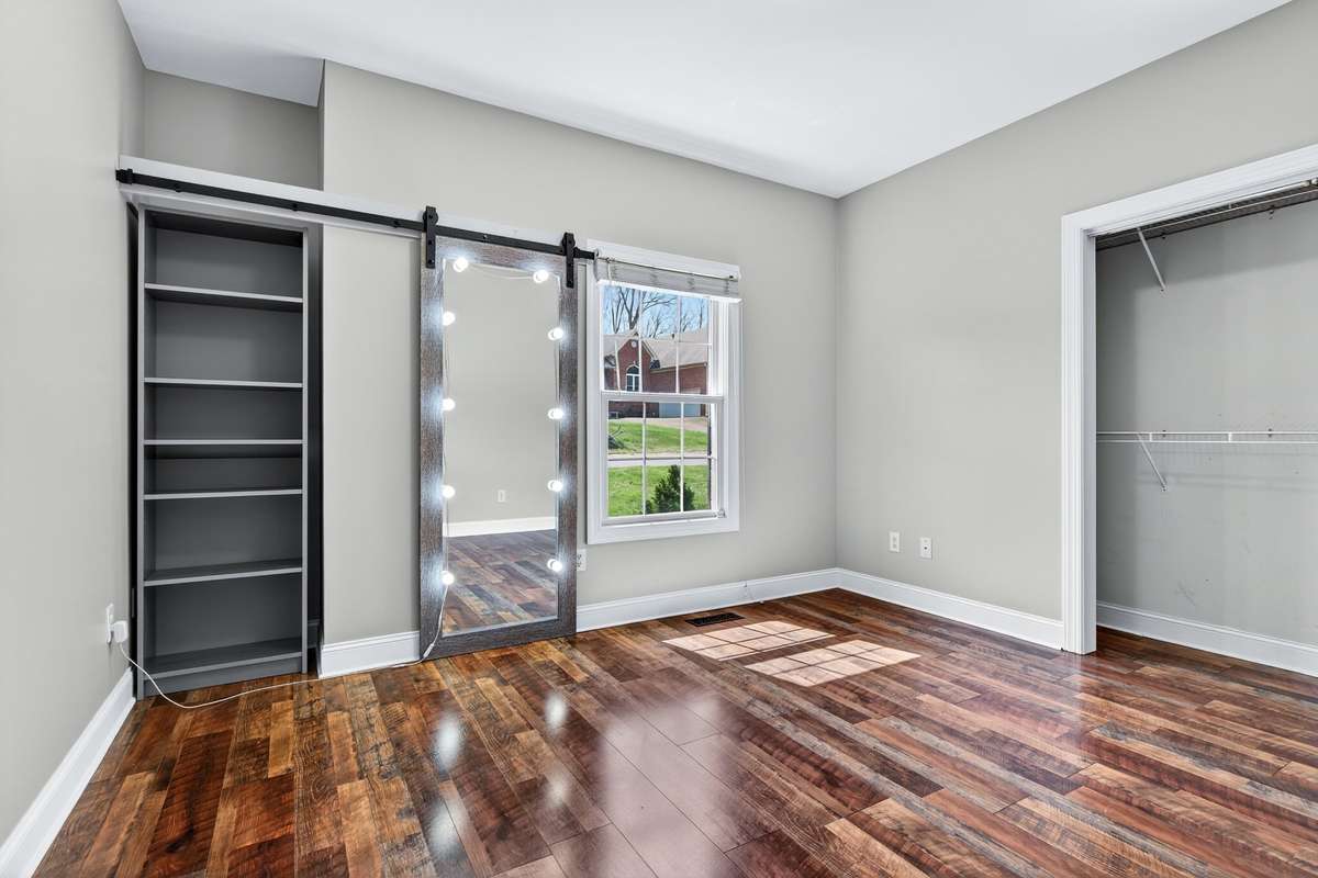 Guest bedroom with sliding mirror door