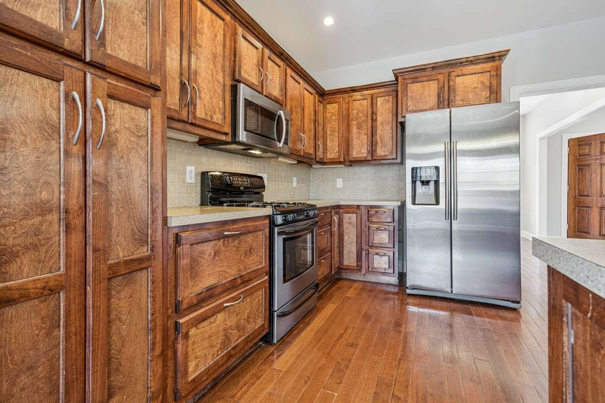 Plenty of cabinets, including some with pull-out shelving, gas stove