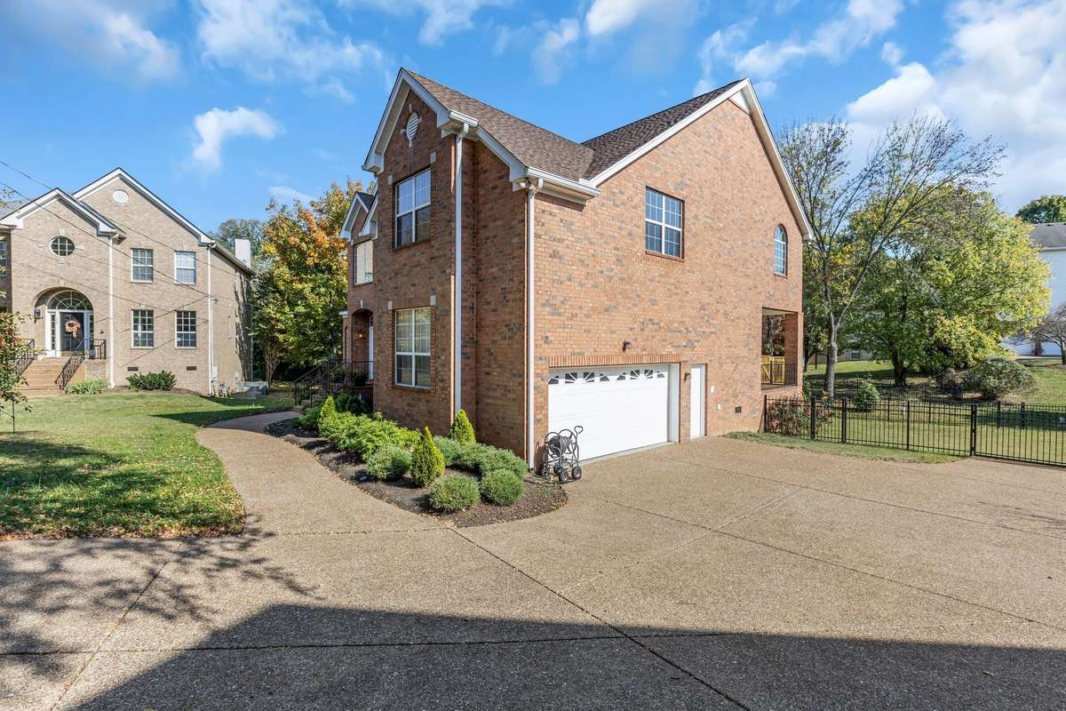 Spacious driveway with room for 3-5 cars in addition to the 2 car garage