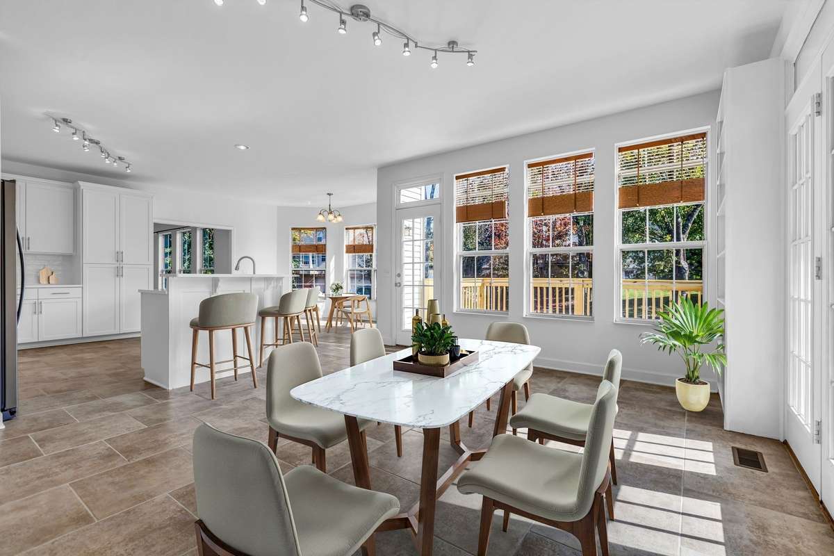 Lots of seating for entertaining in the oversized kitchen area (virtually staged)