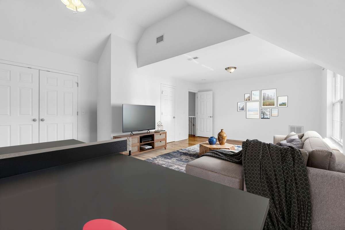 Separate game room concept with entertainment space in Bedroom #2 (virtually staged)