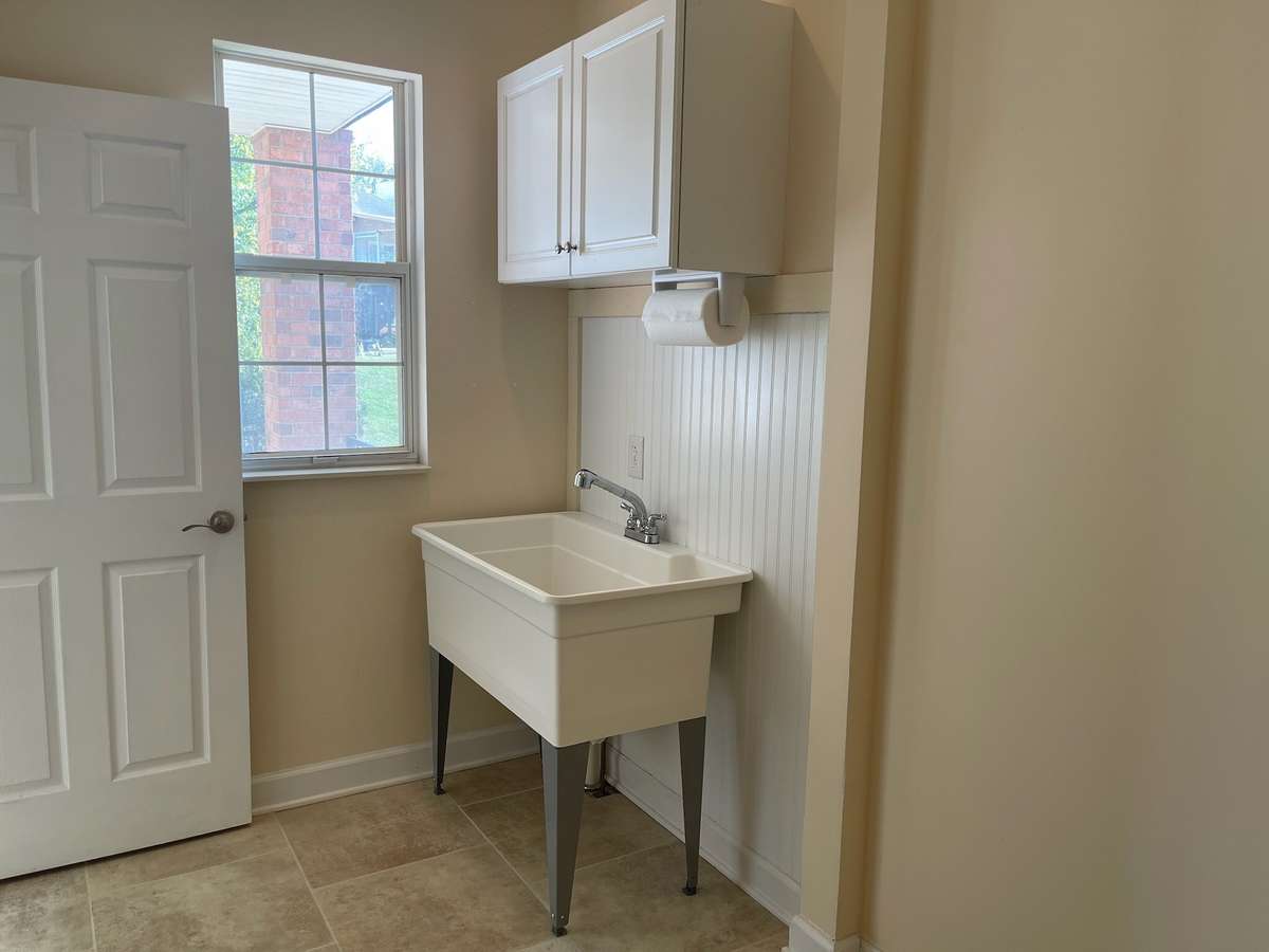Window in Utility Room lets in the natural light and provides view to covered porch and backyard.