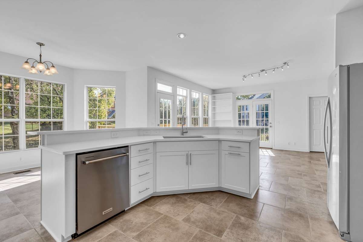 Plenty of room for multiple cooks between the large bar and stovetop